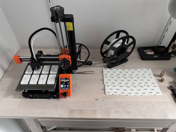 3D printer printing new parts for the device wall