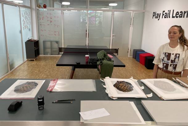 Vanessa Ohlhausen signs her work