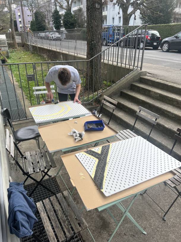 Björn painting the Apps with love logo on the device wall