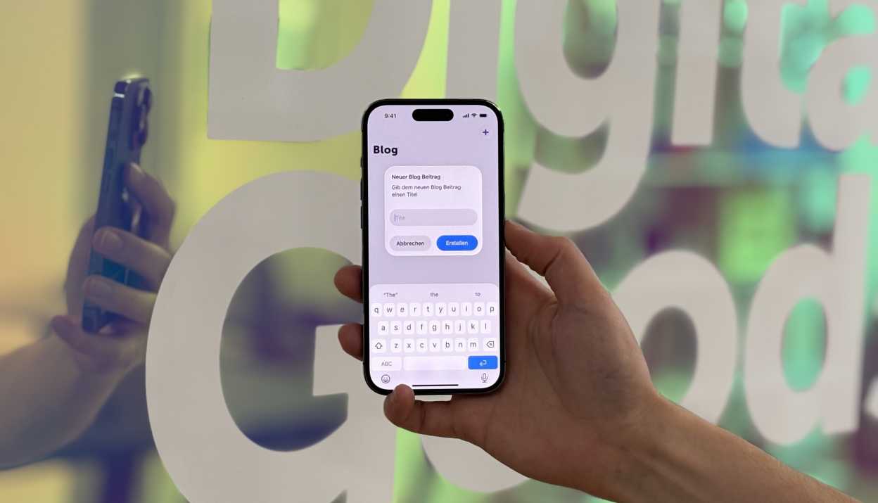 Ein iOS26-Screen vor einer spiegelnden Wand im Büro von Apps with love