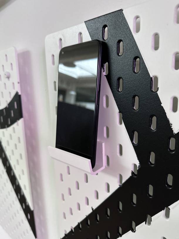 Phone in holder on the new Device Wall
